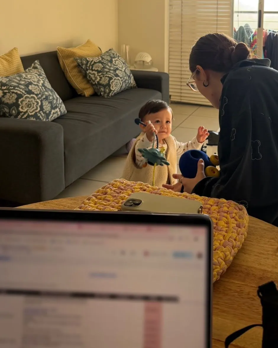 A Sidekick playing with a toddler at home